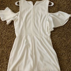 White romper with cut out shoulders.